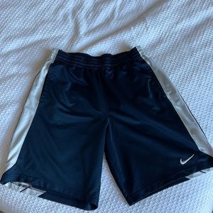 Men’s navy gym short with white stripe down the sides.